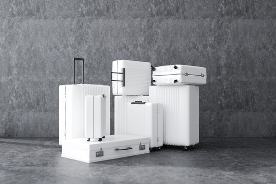 White luggage over concrete wall background