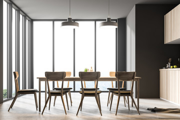 Fototapeta premium Gray panoramic dining room and kitchen interior