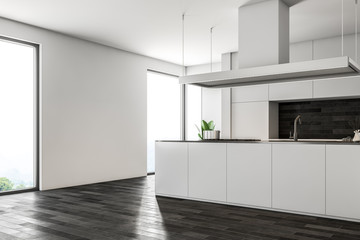 Obraz premium Dark wooden floor kitchen, white counters