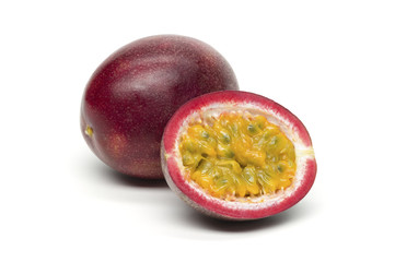 Passion fruit on white background, isolated whole exotic tropical fruit and another cut in half, healthy food, diet nutrition 
