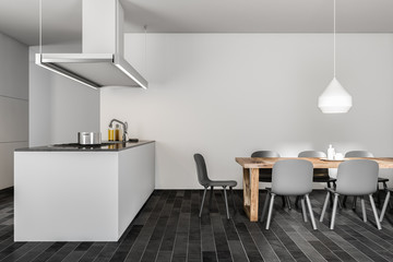 Dark wooden floor kitchen, white island, table