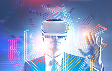 Businessman in VR glasses, circuits interface