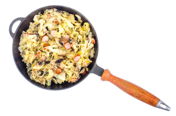 Frying pan with fried cabbage, sausages and mushrooms on white background