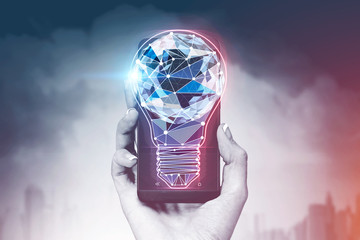 Woman hand with smartphone, light bulb over city
