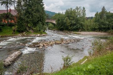 mountain valley with a river after a rain on a summer