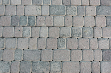 Obraz premium natural stone paving stone road from asphalt background summer
