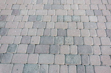 natural stone paving stone road from asphalt background summer