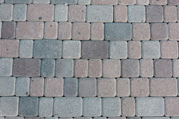 Obraz premium natural stone paving stone road from asphalt background summer