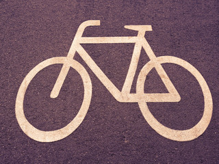 White Bicycle Sign On Asphalt Road In Berlin, Germany