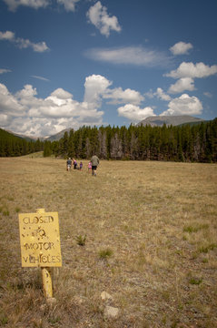 No Motorized Vehicles Sign, with People Hiking in Background, Arapaho National Forest