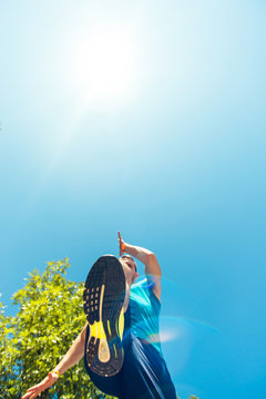 Running Sneakers View From Bottom On Mans Leg. POV. Working Out Outside In The Summer.