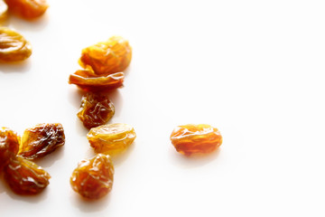 Raisins background / A raisin is a dried grape. Raisins are produced in many regions of the world and may be eaten raw or used in cooking, baking, and brewing.