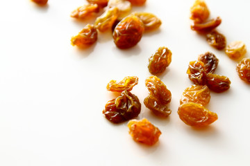 Raisins background / A raisin is a dried grape. Raisins are produced in many regions of the world and may be eaten raw or used in cooking, baking, and brewing.
