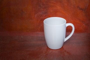 White cup ceramic on wooden