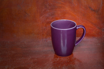 Purple cup ceramic on wooden