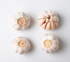 Modern layout of garlics with segments isolated on white background.