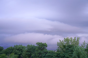 Fototapeta premium dark storm cloud on the sky above woods