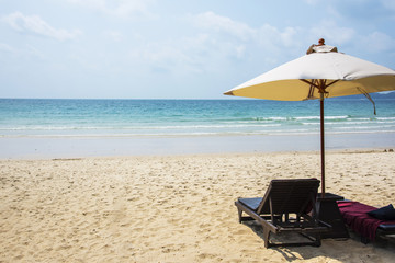 Two beach chairs on the sand beach