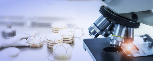 Close-up shot of microscope with metal lens at laboratory