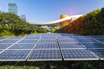 solar panel with skyscrapers of in blue cloud sky,Green city of the future concept