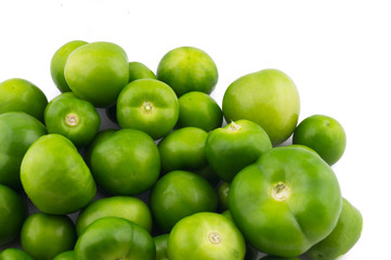 Obraz premium green tomatoes different sizes in white