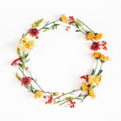Autumn floral composition. Wreath made of fresh flowers on white background. Autumn, fall concept. Flat lay, top view, copy space, square