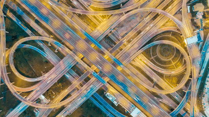 Aerial view highway road intersection at dusk for transportation, distribution or traffic...