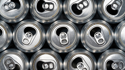 Stack of empty aluminum beer cans, front side view, close up, macro.