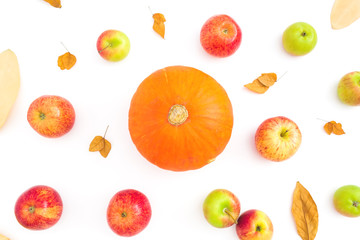 Autumn background with fall dried leaves, apples and orange pumpkin on white background. Flat lay, top view