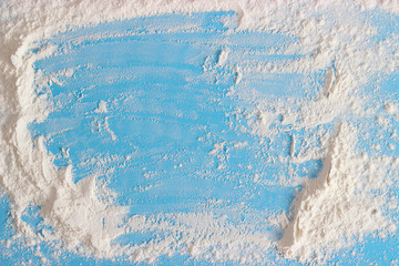Wheat flour on a blue background with space for text