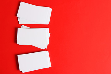  stacks of white business cards on a colored background with space for text.