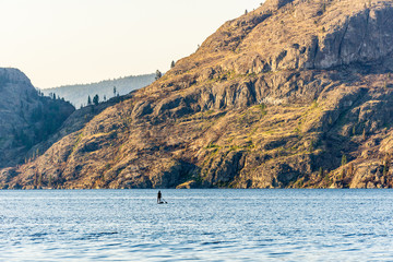 Okanagan lake at summer day with clouds on the sky.