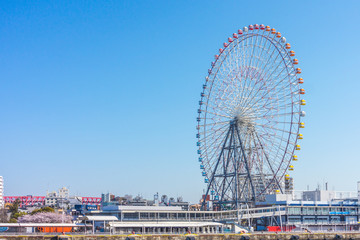 Giant ferris wheel. Massive amusement ride with views.