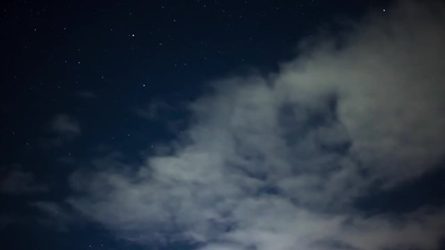 Cliffs at Night, evening clouds and sea timelapse landscape, clouds and sky timelapse, Time lapse clip of white fluffy clouds over blue sky, Scattered clouds float across a midnight blue sky.