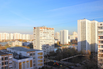 Moscow / Russia - Top view of the house of area Konkovo, sports fields and a Big Konkovsky pond in autumn day against blue sky