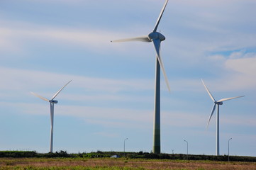 Wind turbines at sunset at a beach in Changhua, Taiwan