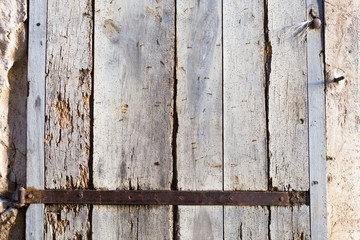 old wooden door with iron forged rivets