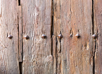 old wooden door with iron forged rivets