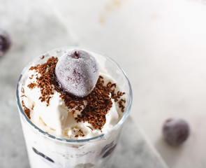 Ice cream with cherry berries on  marble countertop background