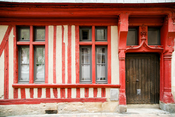 Fototapeta na wymiar Doorway and windows of half-timbered house at french building at the old town