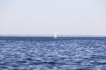 Yachting. A small yacht under sail on the reservoir