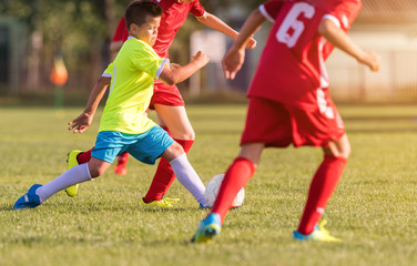 Young children players football match on soccer field