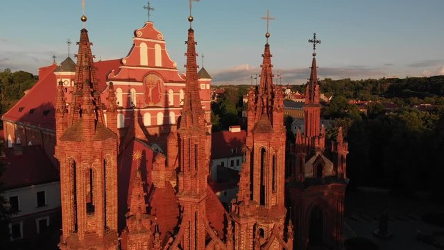 Aerial. Fly through the towers of gothic architecture St. Anne's church in Vilnius old town, Lithuania, Europe.