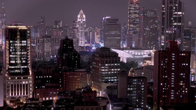 Shanghai skylines at night from a rooftop.
UHD