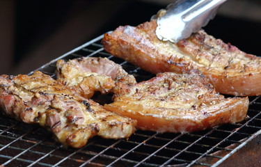 delicious food pork grilling on hot charcoal