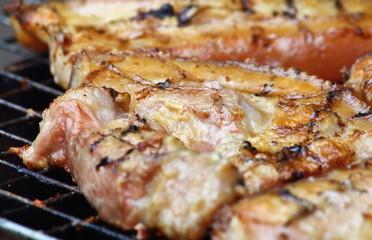 Obraz na płótnie Canvas delicious food pork grilling on hot charcoal
