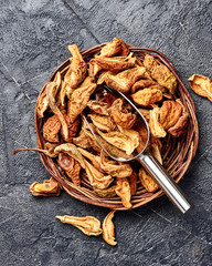 Dried pear, apple on black table. Top view.