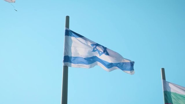 Realistic Israel flag waving in the wind. Slow motion