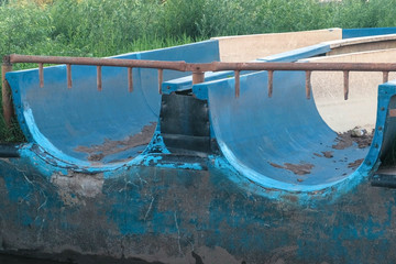 Broken abandoned water slides in the outdoor.