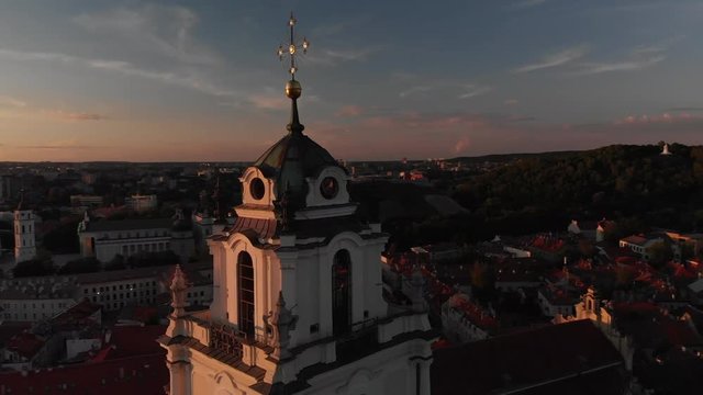 Aerial. Drone fly around the bell tower of St. John's church in Vilnius, Lithuania, Europe. (sventu jonu varpine) Old town and Gediminas castle in the background.
